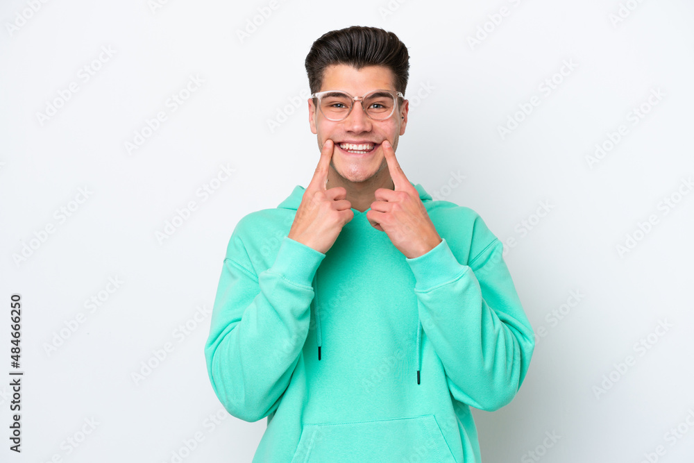 Young handsome caucasian man isolated on white bakcground smiling with a happy and pleasant expression Young handsome caucasian man isolated on white bakcground smiling with a happy and pleasant expression