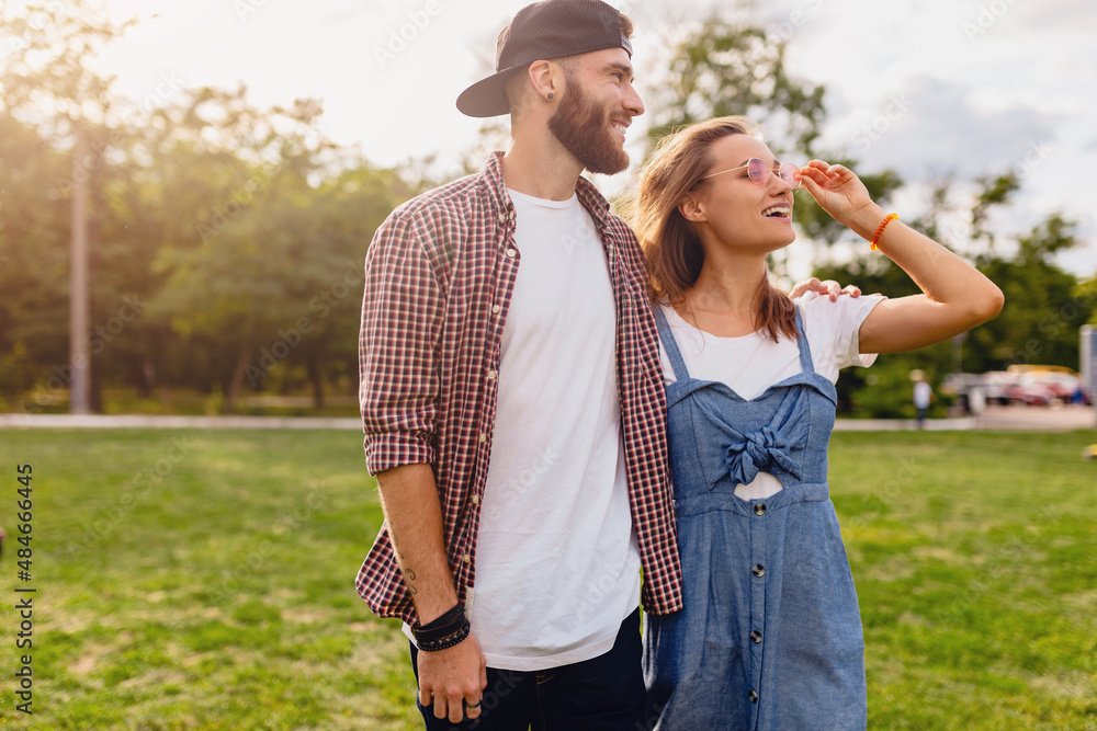 Fototapeta premium young pretty hipster couple walking in park