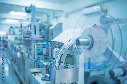 factory, industrial area, automation, technology, Machines for packing products Within the factory, sterile beauty industry in order to maintain maximum cleanliness.shallow focus effect..