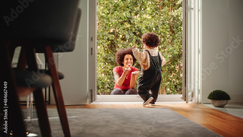 Fotografija Happy Mother Playing with Adorable Baby Boy, Having Fun at Modern Home Living Room