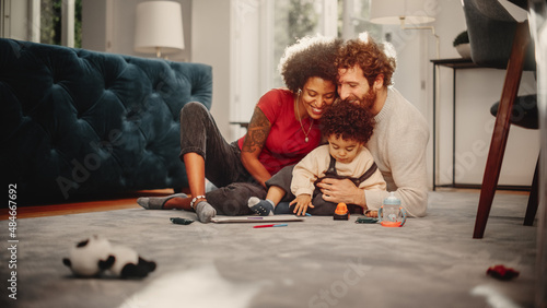 Obraz na plátně Loving Mixed Race Family Playing with Toys with Adorable Baby Boy at Home on Living Room Floor