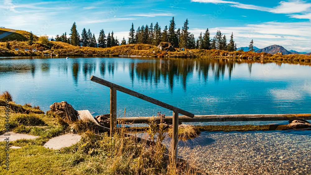 Fototapeta premium Beautiful alpine summer view with reflections at the famous Fleckalm near Kitzbuehel, Tyrol, Austria