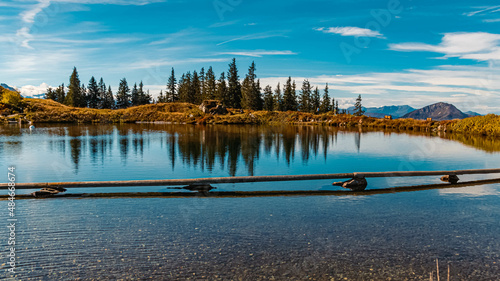 Beautiful alpine summer view with reflections at the famous Fleckalm near Kitzbuehel, Tyrol, Austria