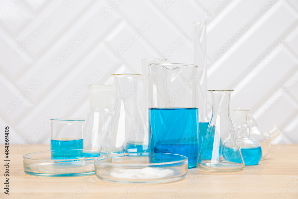 Laboratory glassware with test tubes. flasks, dropper, petri dishes, measuring cups and cylinders for scientific laboratories, laboratory equipment and analysis Laboratory glassware with test tubes. flasks, dropper, petri dishes, measuring cups and cylinders for scientific laboratories, laboratory equipment and analysis