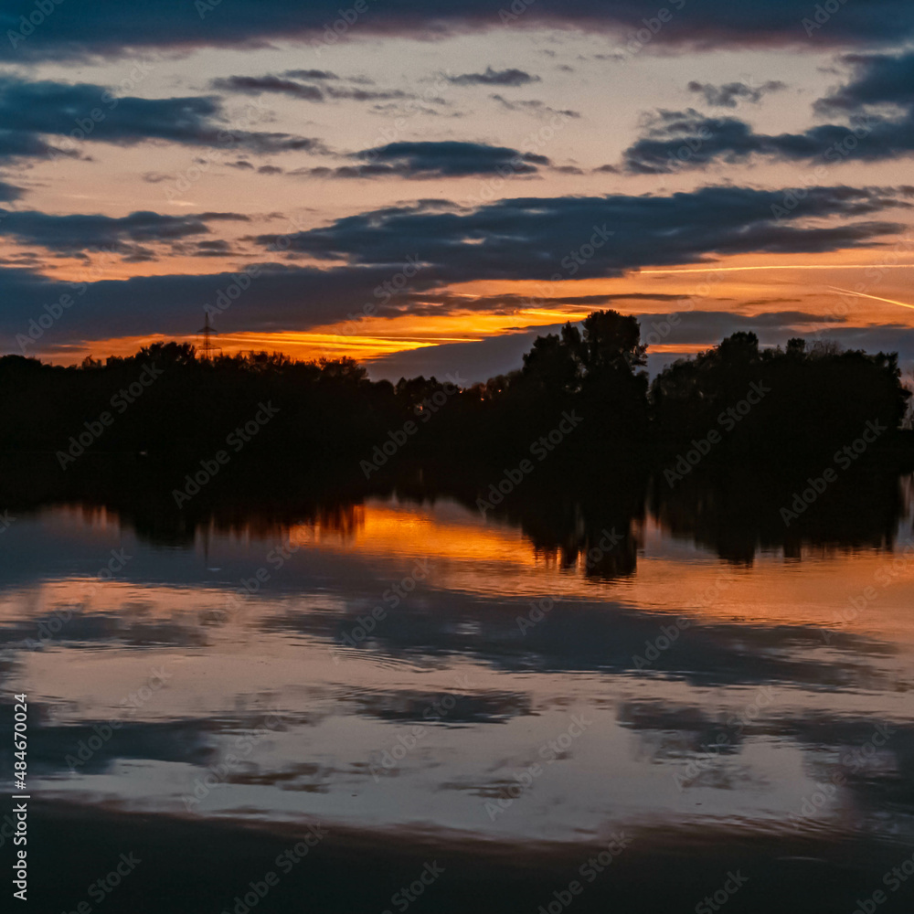 Beautiful sunset with reflections near Plattling, Isar, Bavaria, Germany