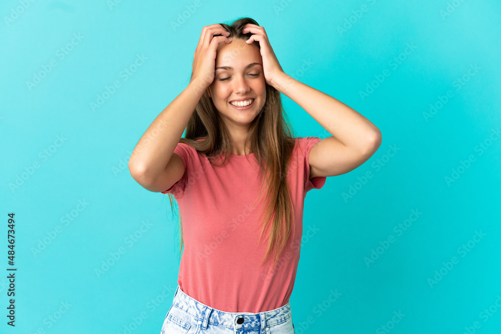 Young woman over isolated blue background laughing Young woman over isolated blue background laughing