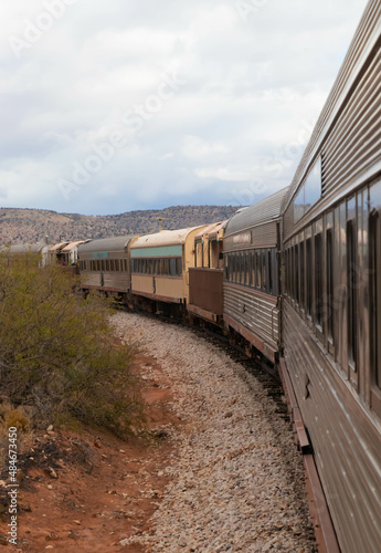 Old train cars running in desert landscape, Arizona