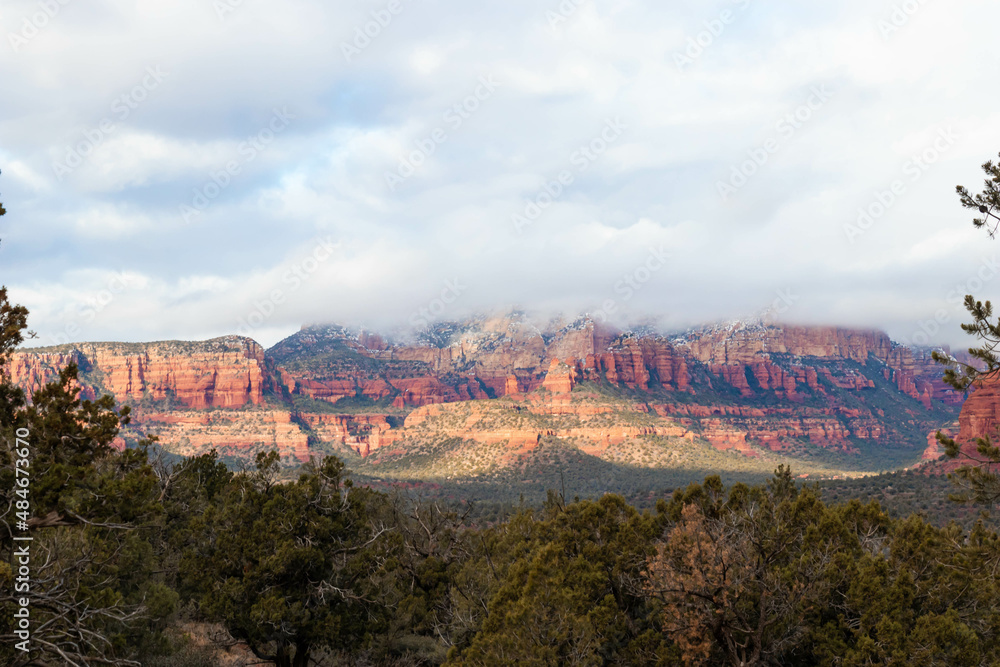 Landscape of Sedona in winter with the red mountains with snow