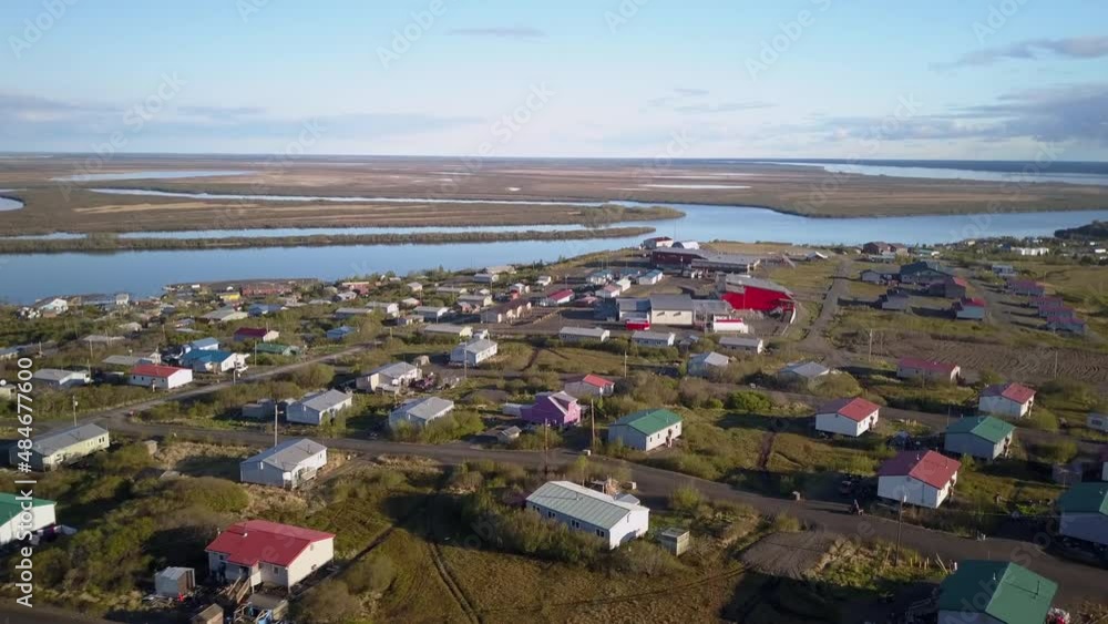 Aerial Scenic Shot Of Residential Houses Near River, Drone Flying Forward Over Landscape - Saint Mary's, Alaska Aerial Scenic Shot Of Residential Houses Near River, Drone Flying Forward Over Landscape - Saint Mary's, Alaska