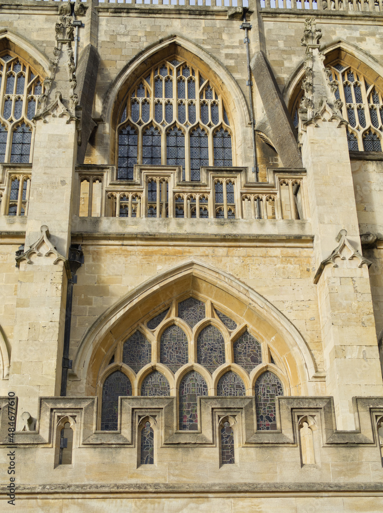 Bath Abbey England UK Stained glass and bath stone detailing with butresses