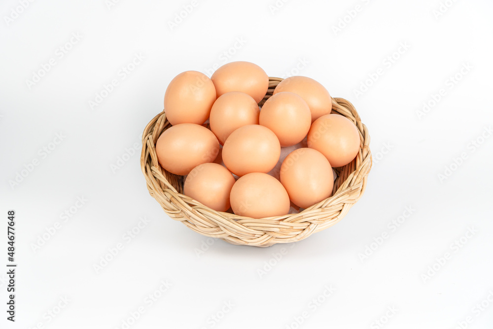 chicken egg in the wood bucket isolated on white background chicken egg in the wood bucket isolated on white background