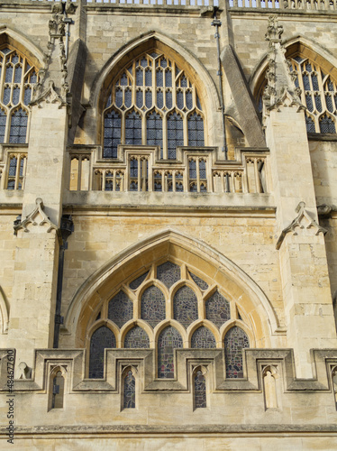 Bath Abbey England UK Stained glass and bath stone detailing with butresses