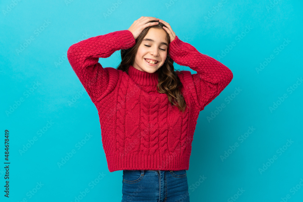 Little caucasian girl isolated on blue background laughing Little caucasian girl isolated on blue background laughing