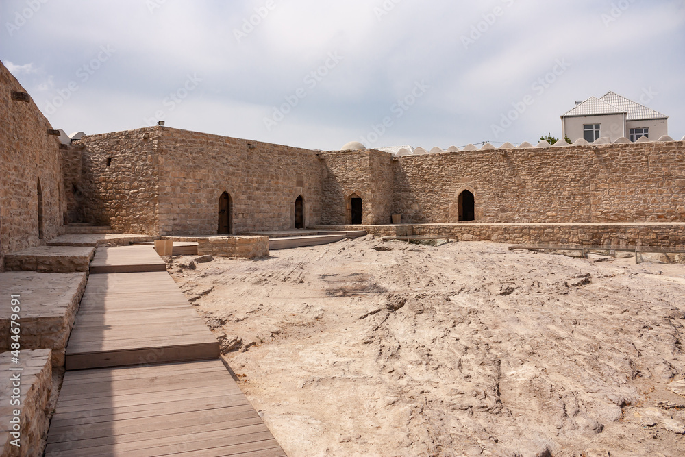 Fototapeta premium Ateshgah fire temple in Surakhani town, a suburb of Baku, Azerbaijan. The tetrapillar altar was built during the 17th and 18th centuries and used as a Hindu, Sikh, and Zoroastrian place of worship