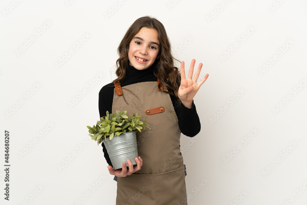 Little girl holding a plant isolated on white background happy and counting four with fingers Little girl holding a plant isolated on white background happy and counting four with fingers
