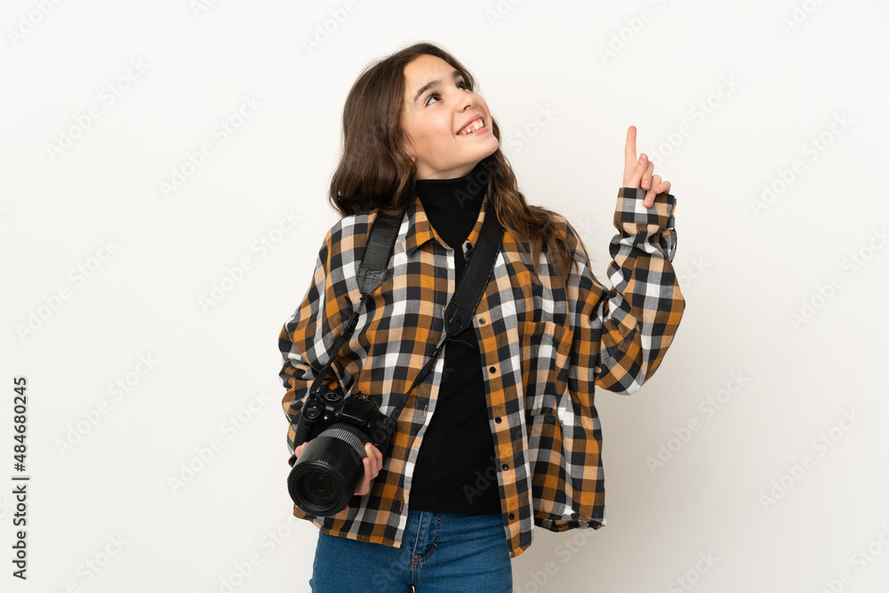 Little photographer girl isolated on background pointing up a great idea Little photographer girl isolated on background pointing up a great idea