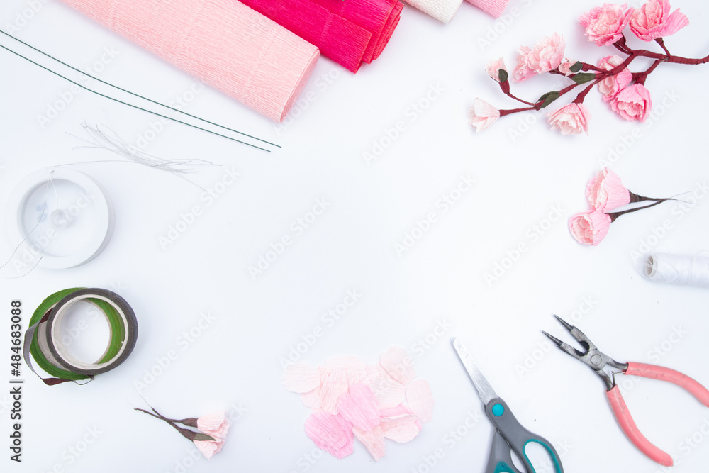 Tools and materials for creating a spring branch with sakura flowers from corrugated paper. Do it yourself. Copy space Tools and materials for creating a spring branch with sakura flowers from corrugated paper. Do it yourself. Copy space