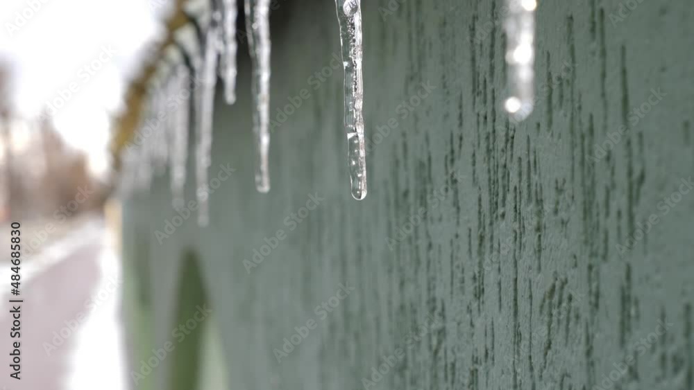 Heated icicles melt and drip water. Heated icicles melt and drip water.