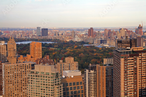 Central Park reservoir and concrete buildings at the sunset
