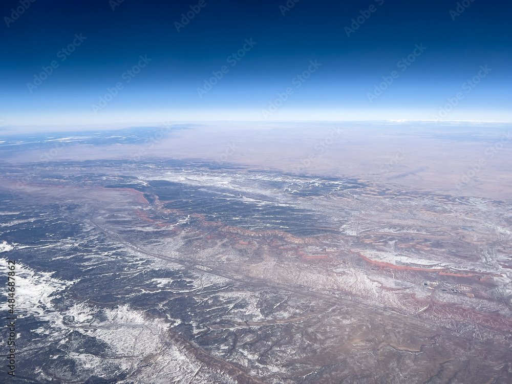 Aerial view of mountains in winter snow in southwest USA