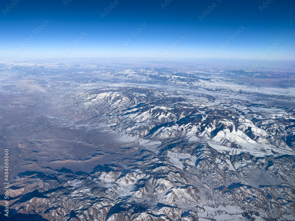 Southwest USA mountains covered in snow in winter aerial view