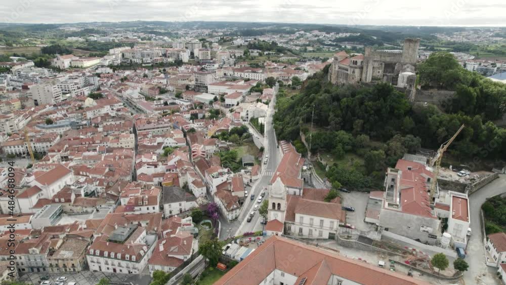 Leiria historical center with castle in background, Portugal. Aerial circling tilt up reveal Leiria historical center with castle in background, Portugal. Aerial circling tilt up reveal