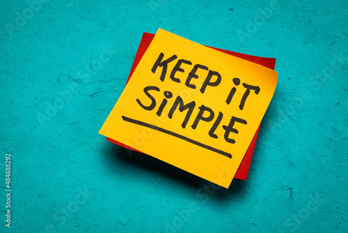 keep it simple  inspirational writing - reminder note on a brown textured mulberry paper, simplicity, minimalism and lifestyle concept photo