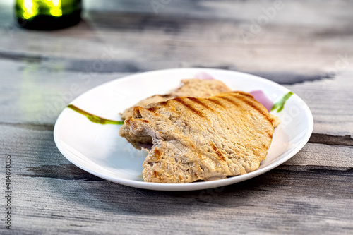 grilled turkey breast lies on a plate