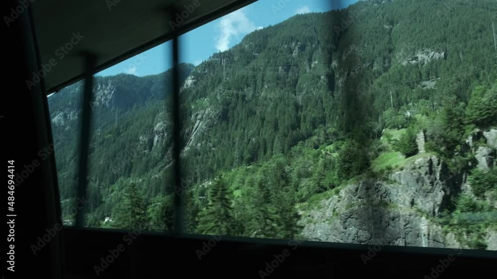 Driving by car through a tunnel with a wounderful view on mountainous Switzerland during summer. Driving by car through a tunnel with a wounderful view on mountainous Switzerland during summer.