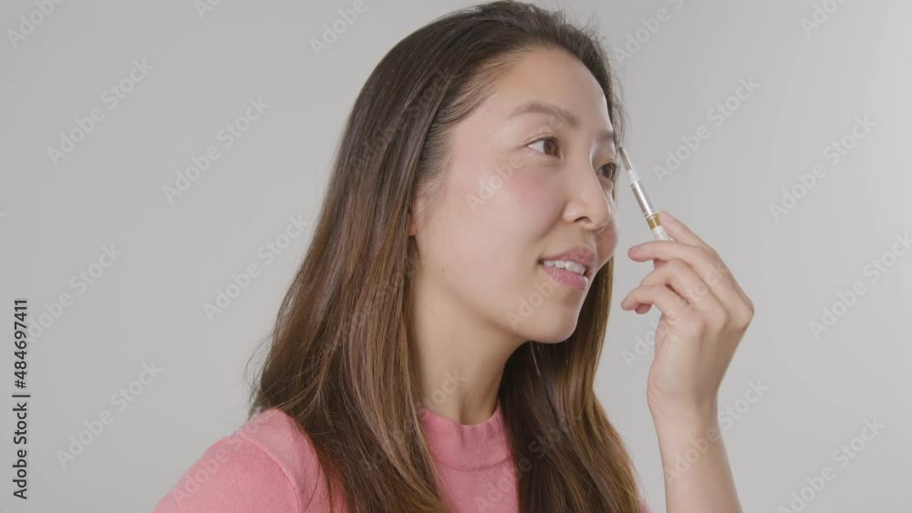 Tracking Side Shot of Woman Brushing Eyebrows Tracking Side Shot of Woman Brushing Eyebrows