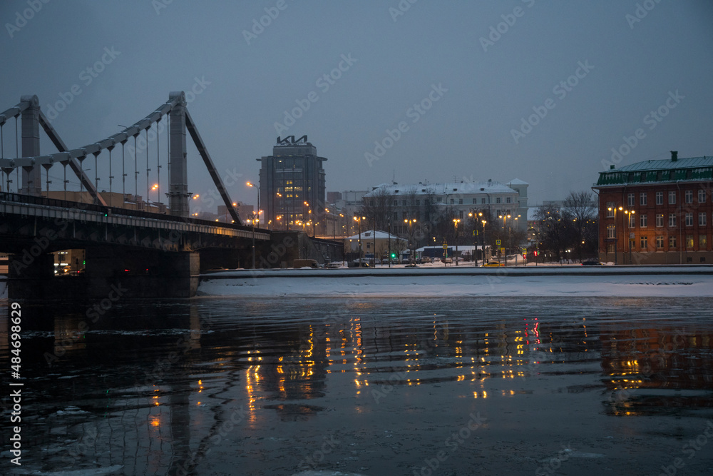 Nice city scene with the bridge and beautiful golden reflection of lights