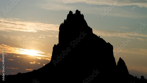 Shiprock Peak at Sunrise, Time Lapse with Colorful Cloudsn, New Mexico, USA photo