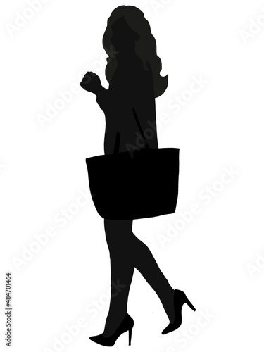 Silhouette of a shopping girl who is walking