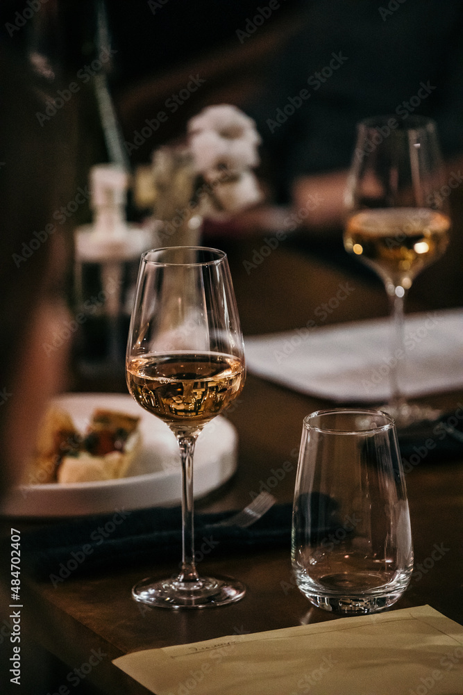 wine glasses and bottles of wine in the entourage of the wine bar in the evening wine glasses and bottles of wine in the entourage of the wine bar in the evening