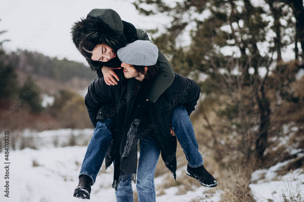 Couple together in winter park having fun Couple together in winter park having fun