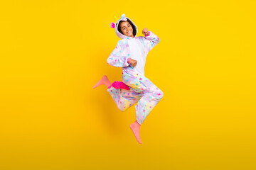 Full body profile side photo of young excited black girl go jump sleepover hood isolated over yellow color background