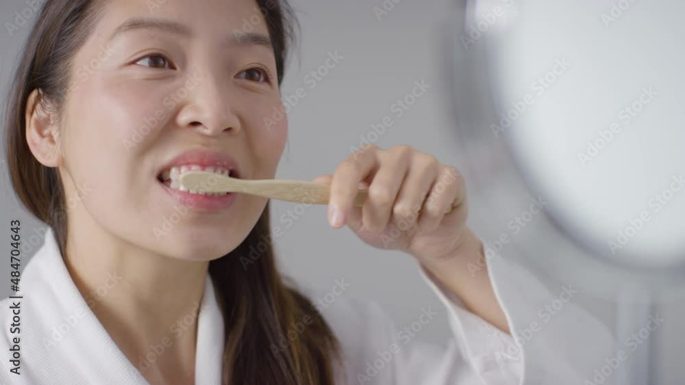 Close Up Shot of Woman Brushing Teeth and then Smiling Close Up Shot of Woman Brushing Teeth and then Smiling