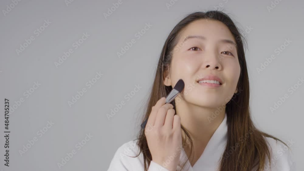 Mid Shot of Woman Applying Foundation with Copy Space Mid Shot of Woman Applying Foundation with Copy Space