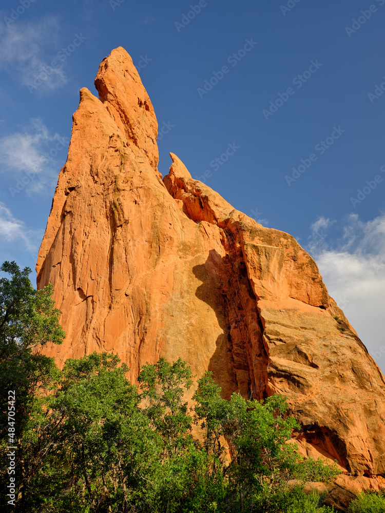 Fototapeta premium Red and orange sandstone cliffs in late afternoon light in Garden of the Gods Colorado Springs