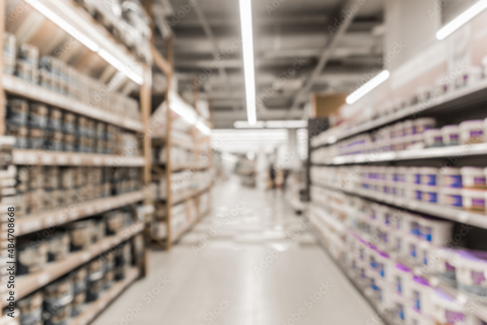 Blurry background of a hardware store with shelves and materials for interior and home design