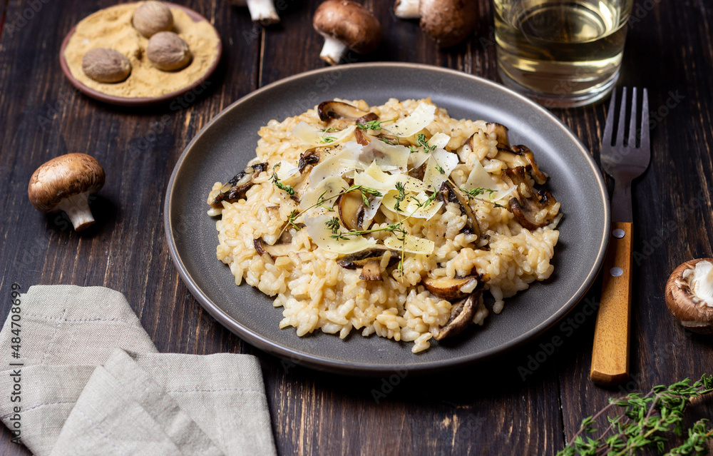 Risotto with mushrooms, cheese and thyme. Vegetarian food. Italian food. Risotto with mushrooms, cheese and thyme. Vegetarian food. Italian food.