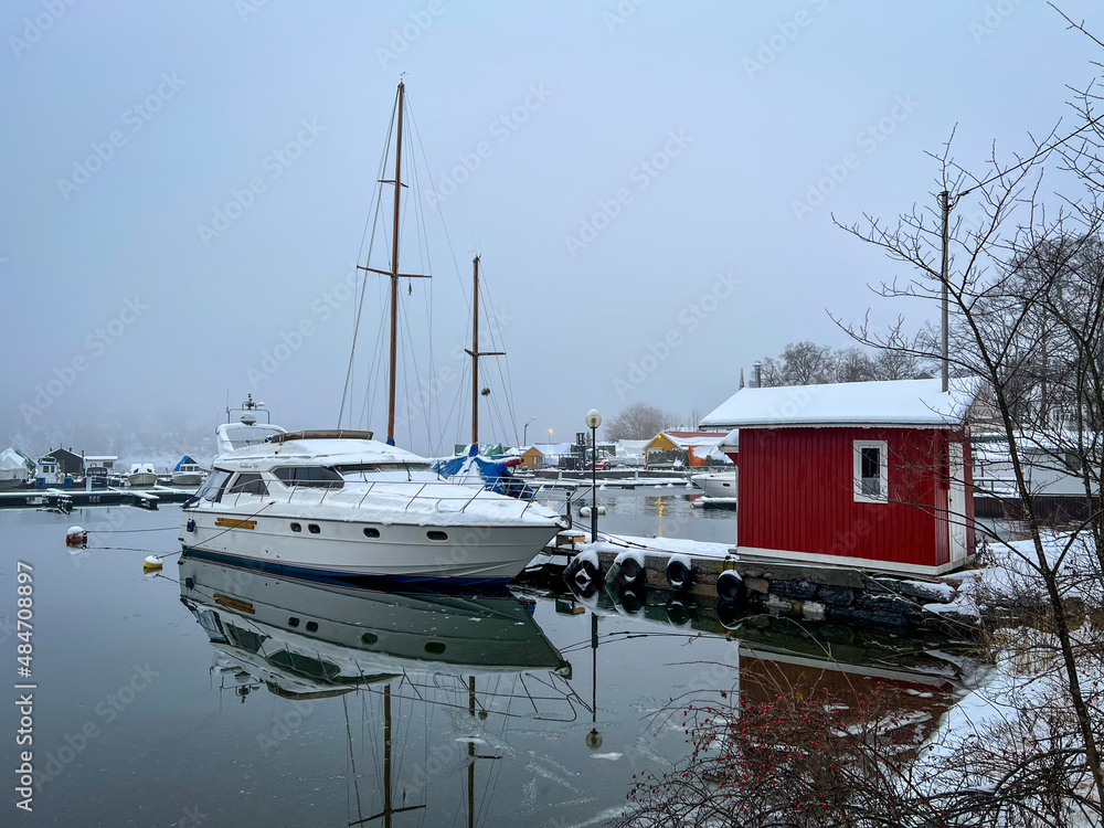 boats in the marina in Oslo fiordo sea, winter and snow