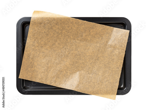 Photographie Baking sheet with brown parchment paper isolated on a white background