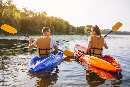 фотографія Couple together kayaking on the river