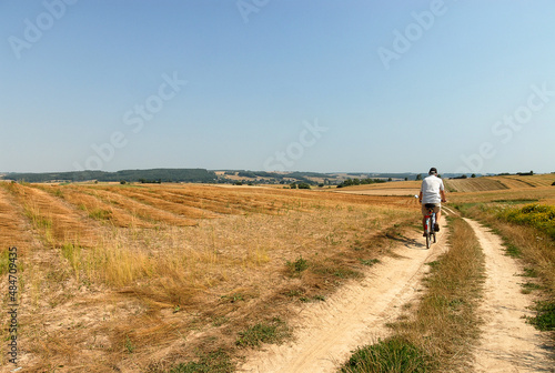 Poland - June 2018: Cyclist on a dirt road