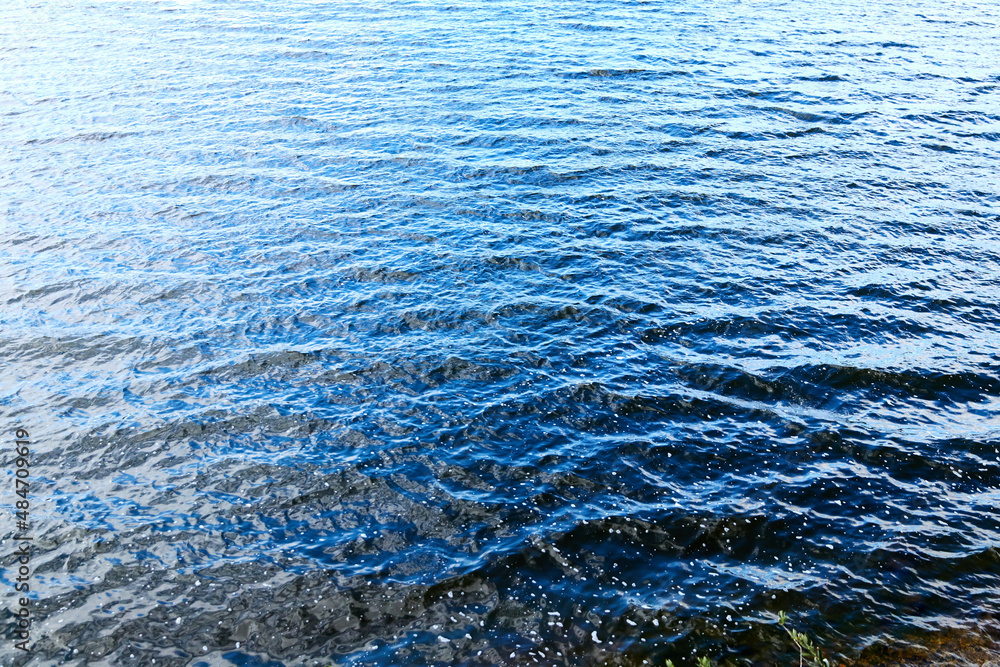 waves of lake water. blue water background waves of lake water. blue water background