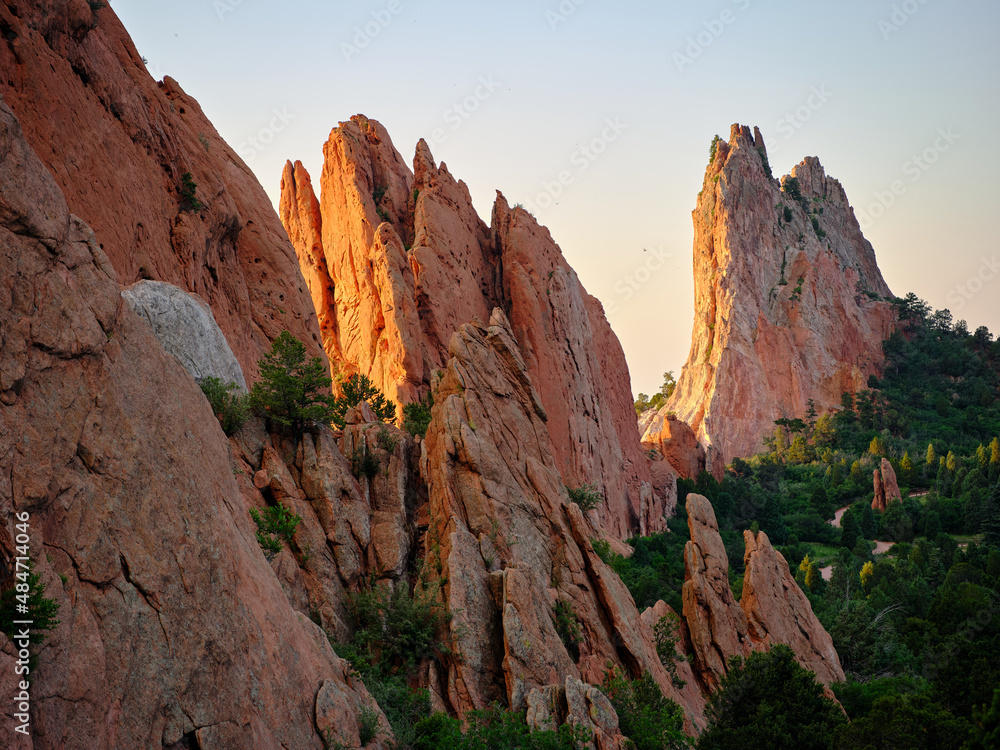 Red and orange sandstone monoliths at sunrise in Garden of the Gods Colorado Springs