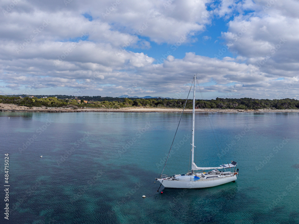 sailing yacht anchored in front Es Dolç beach, Colònia de Sant Jordi, ses Salines, Mallorca, Balearic Islands, Spain