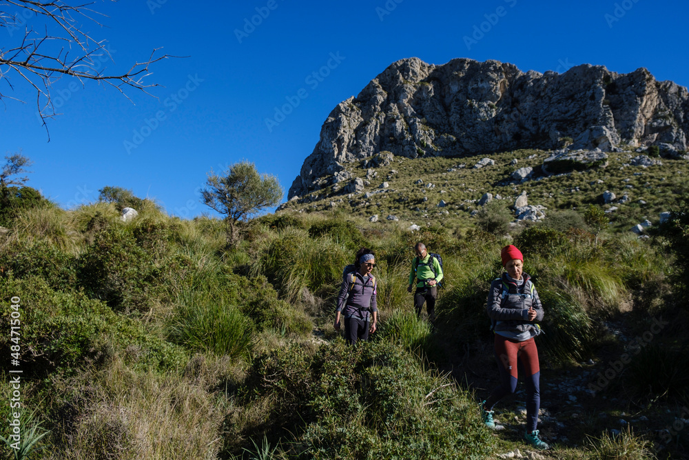 walkers descending Cucuia de Fartaritx, Pollença, Mallorca, Balearic Islands, Spain