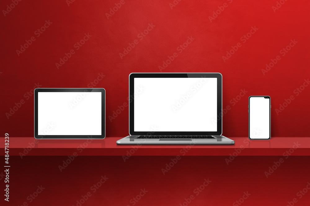 Laptop, mobile phone and digital tablet pc on red wall shelf. Horizontal background Laptop, mobile phone and digital tablet pc on red wall shelf. Horizontal background